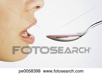 Stock Photo - woman taking a 
spoonful of medicine. 
fotosearch - search 
stock photos, 
pictures, images, 
and photo clipart