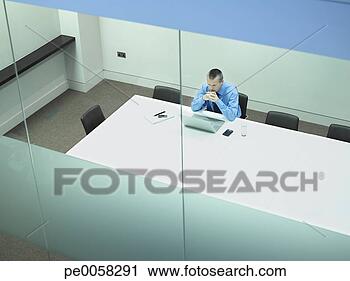 Stock Photography - businessman sitting 
at table with 
laptop in office. 
fotosearch - search 
stock photos, 
pictures, images, 
and photo clipart