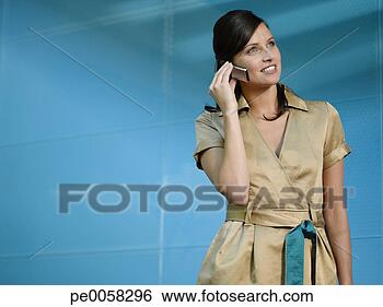 Stock Photo - businesswoman 
on mobile phone 
in blue office. 
fotosearch - search 
stock photos, 
pictures, images, 
and photo clipart