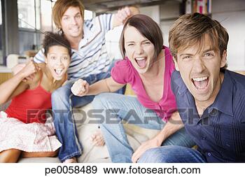 Stock Photograph - two couples in 
a living room 
having fun. fotosearch 
- search stock 
photos, pictures, 
images, and photo 
clipart