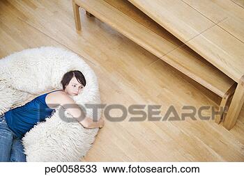 Stock Photo - woman on a furry 
bean bag chair. 
fotosearch - search 
stock photos, 
pictures, images, 
and photo clipart