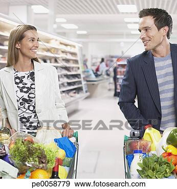Stock Photograph - couple grocery 
shopping. fotosearch 
- search stock 
photos, pictures, 
images, and photo 
clipart