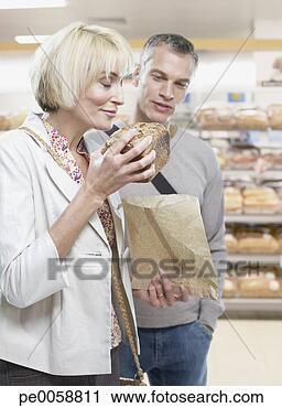 Stock Photography - couple grocery 
shopping. fotosearch 
- search stock 
photos, pictures, 
images, and photo 
clipart
