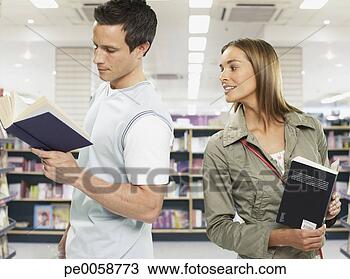 Stock Photo - couple looking 
at books in store. 
fotosearch - search 
stock photos, 
pictures, images, 
and photo clipart