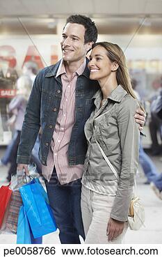 Stock Photo - couple shopping 
in mall. fotosearch 
- search stock 
photos, pictures, 
images, and photo 
clipart