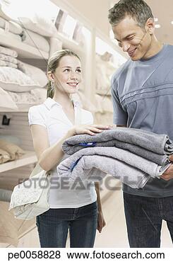 Stock Photo - man and girl looking 
at towels in a 
store. fotosearch 
- search stock 
photos, pictures, 
images, and photo 
clipart