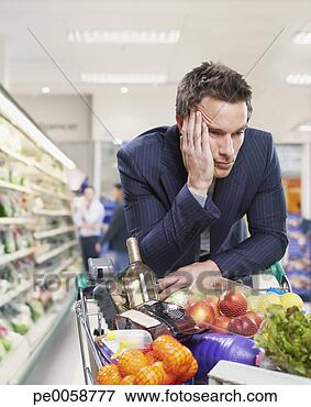 Picture - man grocery shopping. 
fotosearch - search 
stock photos, 
pictures, images, 
and photo clipart