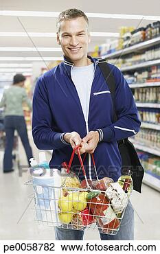 Stock Photo - man grocery shopping. 
fotosearch - search 
stock photos, 
pictures, images, 
and photo clipart