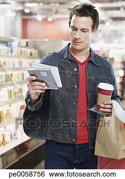 Stock Photo - man looking at 
cds in store. 
fotosearch - search 
stock photos, 
pictures, images, 
and photo clipart
