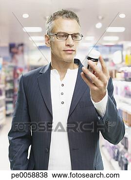Stock Photo - man shopping in 
store. fotosearch 
- search stock 
photos, pictures, 
images, and photo 
clipart