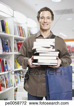 Stock Photo - man in store with 
stack of books. 
fotosearch - search 
stock photos, 
pictures, images, 
and photo clipart