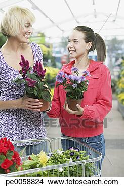 Stock Photo - woman and girl 
shopping for plants. 
fotosearch - search 
stock photos, 
pictures, images, 
and photo clipart