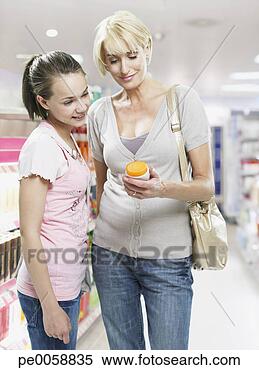 Stock Image - woman and girl 
shopping in store. 
fotosearch - search 
stock photos, 
pictures, images, 
and photo clipart
