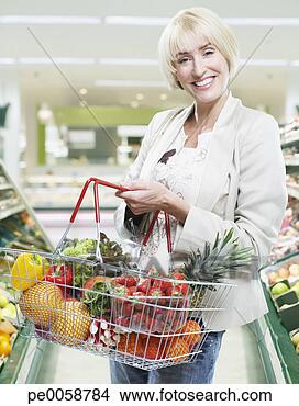 Stock Photo - woman grocery 
shopping. fotosearch 
- search stock 
photos, pictures, 
images, and photo 
clipart