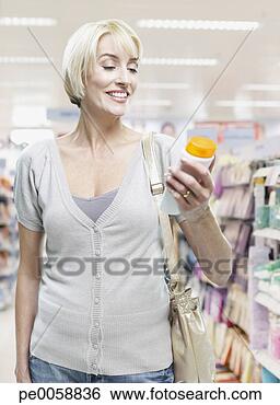 Stock Photo - woman shopping 
in store. fotosearch 
- search stock 
photos, pictures, 
images, and photo 
clipart