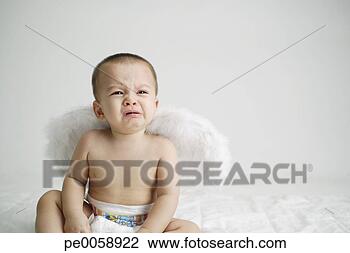 Stock Photo - baby crying wearing 
wings. fotosearch 
- search stock 
photos, pictures, 
images, and photo 
clipart