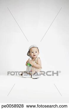 Stock Photo - baby holding bottle 
of water. fotosearch 
- search stock 
photos, pictures, 
images, and photo 
clipart