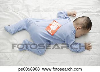 Stock Photo - baby lying down 
with fragile picture 
on back. fotosearch 
- search stock 
photos, pictures, 
images, and photo 
clipart