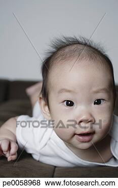 Stock Photo - baby lying on 
stomach. fotosearch 
- search stock 
photos, pictures, 
images, and photo 
clipart