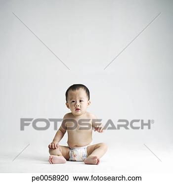 Stock Photography - baby sitting looking 
at camera. fotosearch 
- search stock 
photos, pictures, 
images, and photo 
clipart