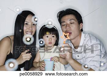 Stock Photograph - couple with young 
girl blowing bubbles. 
fotosearch - search 
stock photos, 
pictures, images, 
and photo clipart