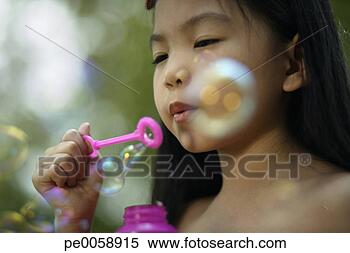 Stock Image - girl blowing bubbles. 
fotosearch - search 
stock photos, 
pictures, images, 
and photo clipart