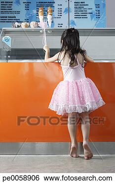 Stock Photo - girl in costume 
in ice cream store. 
fotosearch - search 
stock photos, 
pictures, images, 
and photo clipart
