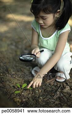 Stock Photography - girl holding magnifying 
glass outdoors. 
fotosearch - search 
stock photos, 
pictures, images, 
and photo clipart