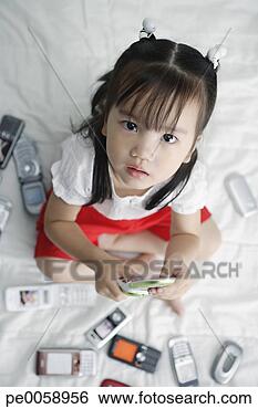 Stock Photo - girl with many 
mobile phones 
around her. fotosearch 
- search stock 
photos, pictures, 
images, and photo 
clipart