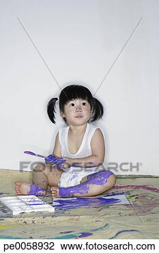 Stock Photo - girl painting 
on paper and legs. 
fotosearch - search 
stock photos, 
pictures, images, 
and photo clipart