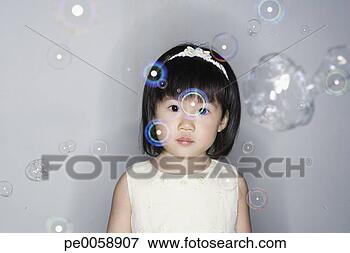 Picture - girl standing 
with bubbles around 
her. fotosearch 
- search stock 
photos, pictures, 
images, and photo 
clipart