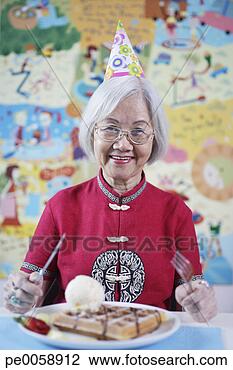 Stock Photo - woman and young 
boy sitting at 
table. fotosearch 
- search stock 
photos, pictures, 
images, and photo 
clipart