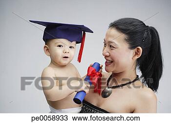 Stock Photo - woman and young 
boy in graduation 
cap. fotosearch 
- search stock 
photos, pictures, 
images, and photo 
clipart