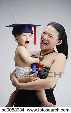 Stock Photo - woman and young 
boy in graduation 
cap. fotosearch 
- search stock 
photos, pictures, 
images, and photo 
clipart