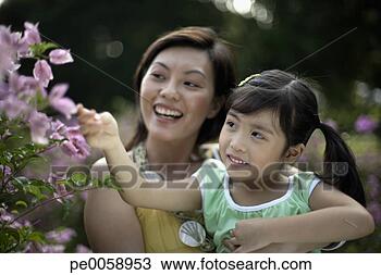 Stock Photo - woman and young 
girl outdoors. 
fotosearch - search 
stock photos, 
pictures, images, 
and photo clipart