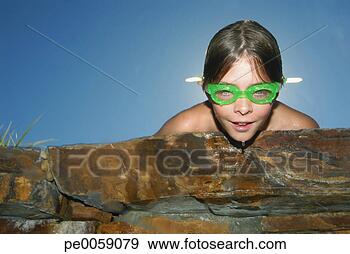 Stock Photograph - boy in swim goggles 
looking over stone 
wall. fotosearch 
- search stock 
photos, pictures, 
images, and photo 
clipart