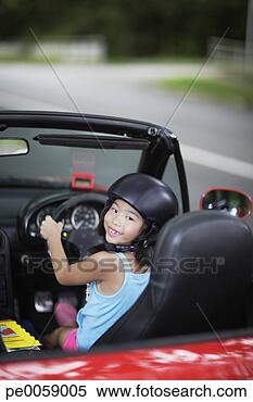 Stock Image - girl in car wearing 
helmet. fotosearch 
- search stock 
photos, pictures, 
images, and photo 
clipart