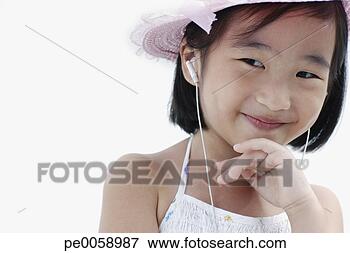 Picture - girl wearing earbuds 
and hat smiling. 
fotosearch - search 
stock photos, 
pictures, images, 
and photo clipart