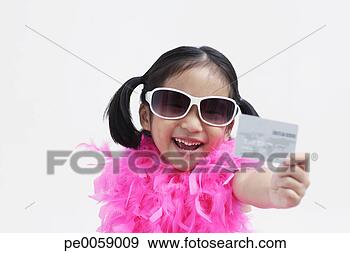 Stock Photograph - girl wearing sunglasses 
holding credit 
card. fotosearch 
- search stock 
photos, pictures, 
images, and photo 
clipart