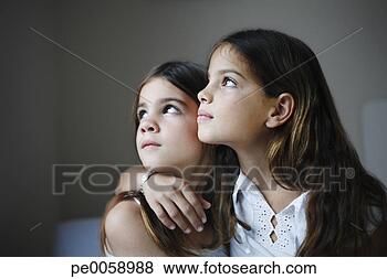 Stock Photo - two sisters embracing. 
fotosearch - search 
stock photos, 
pictures, images, 
and photo clipart