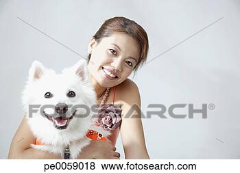 Stock Photo - woman with dog 
indoors. fotosearch 
- search stock 
photos, pictures, 
images, and photo 
clipart
