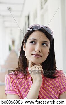 Stock Image - woman resting 
chin on hand. 
fotosearch - search 
stock photos, 
pictures, images, 
and photo clipart