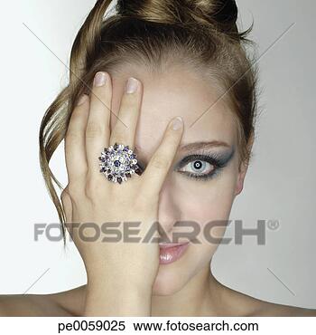 Stock Image - woman wearing 
large ring. fotosearch 
- search stock 
photos, pictures, 
images, and photo 
clipart