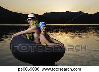 Stock Photo - couple in an inner 
tube by a lake. 
fotosearch - search 
stock photos, 
pictures, images, 
and photo clipart
