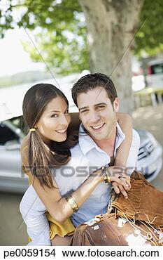 Stock Photo - couple outdoors 
near convertible 
car. fotosearch 
- search stock 
photos, pictures, 
images, and photo 
clipart