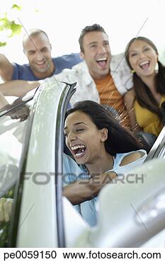 Stock Photography - four friends in 
a convertible 
car having fun. 
fotosearch - search 
stock photos, 
pictures, images, 
and photo clipart