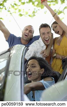 Stock Photograph - four friends in 
a convertible 
car having fun. 
fotosearch - search 
stock photos, 
pictures, images, 
and photo clipart