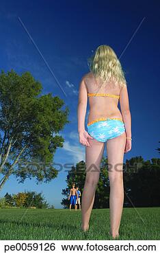 Stock Photo - girl standing 
across a field 
from two boys. 
fotosearch - search 
stock photos, 
pictures, images, 
and photo clipart