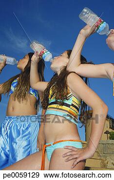 Stock Photograph - three girls in 
swimwear drinking 
bottled water. 
fotosearch - search 
stock photos, 
pictures, images, 
and photo clipart