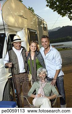 Stock Photo - two couples outside 
recreational vehicle 
with fishing pole. 
fotosearch - search 
stock photos, 
pictures, images, 
and photo clipart